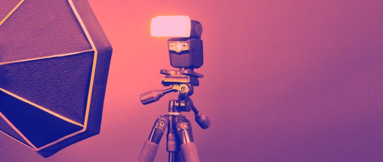 Flash light on tripod in studio production set up for professional photographer shooting photo or fi